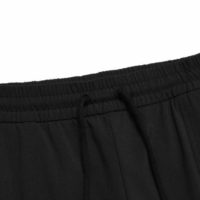 WOMEN’S ARCHELON WOVEN TRAINING WIDE PANTS CARBON BLACK